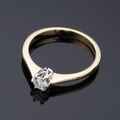 Gold ring with diamond.