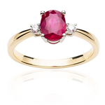 Gold ring with large ruby and diamonds.