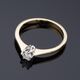 Gold ring with diamond.